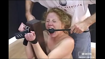 A call girl is taken by surprise, bitch stripped, spanked and bound.  Then hung spread eagle on the rack and disciplined.